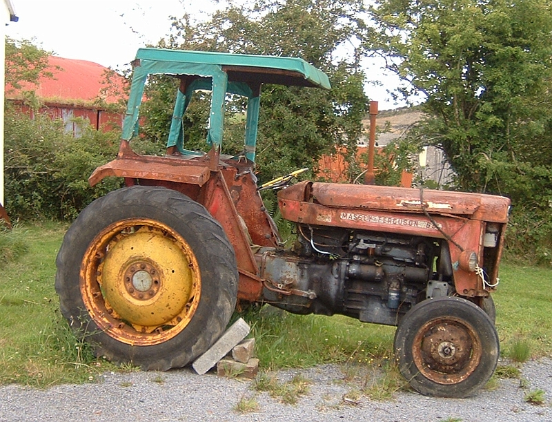 Tractor by cottage.JPG